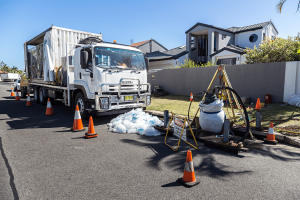 Photo of a relining truck next to a residential area where they are rehabilitating the stormwater