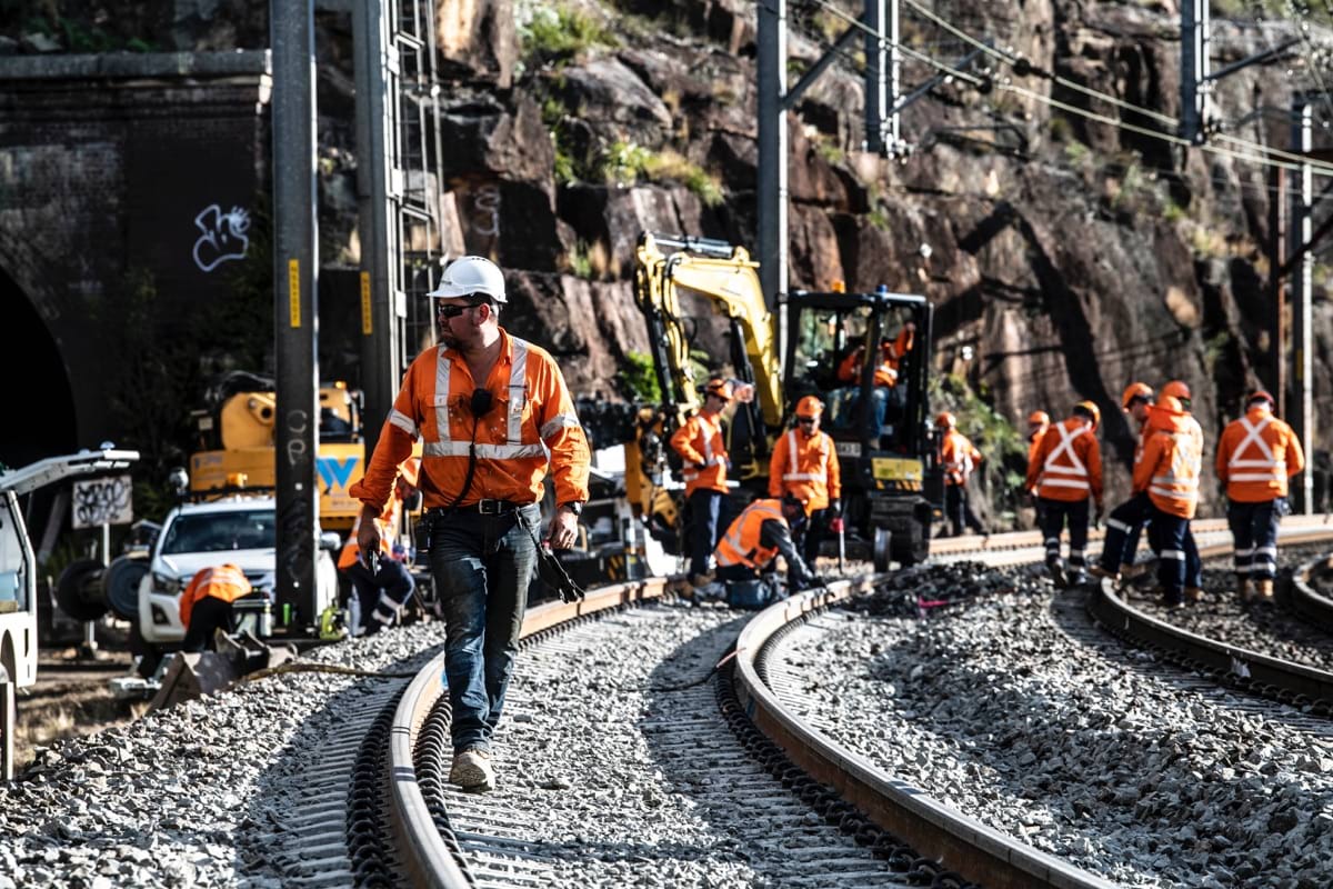 Abergeldie staff walking on rail during possession