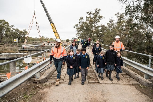 Abergeldie staff and Children walking on Matthewes Bridge