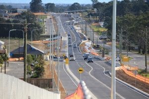 Cars driving along Schofields Road