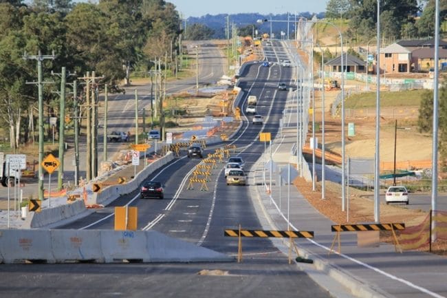 Cars driving along Schofields Road