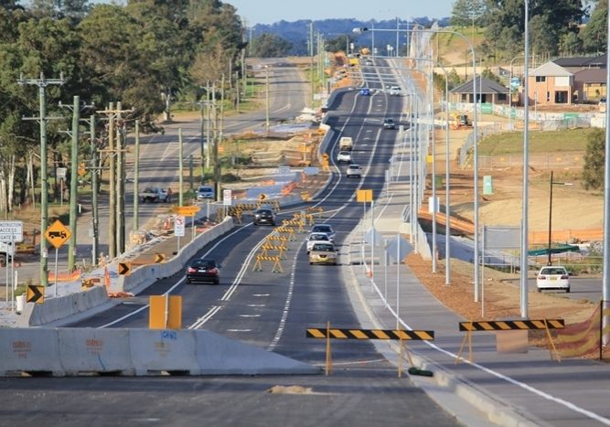 Cars driving along Schofields Road