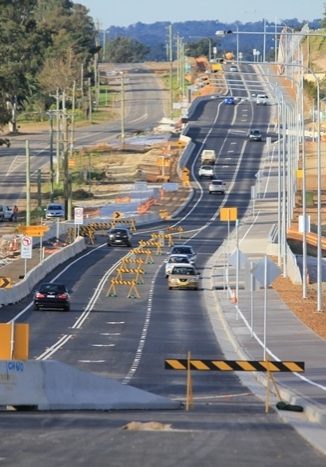 Cars driving along Schofields Road